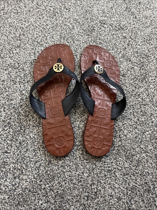 Tory Burch Shoes - Tory Burch Black Leather Flip Flops with Brown Logo-Embossed Sole